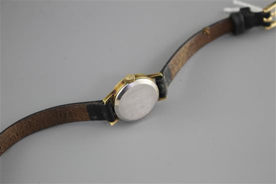 A ladys steel and gold plated Omega manual wind wrist watch, on associated leather strap.